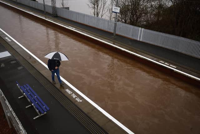 Heavy rainfall last month made the railway line at Bowling station in West Dunbartonshire look more like a canal (Picture: Jeff J Mitchell/Getty Images)