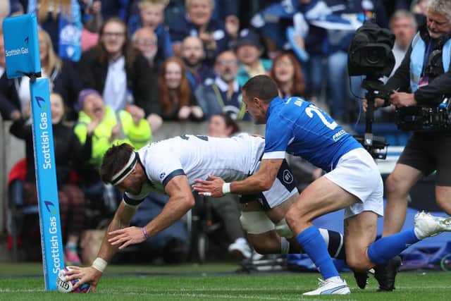 Scotland's Josh Bayliss scores the third and final try of the match against Italy.