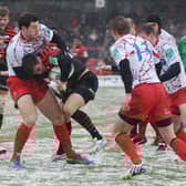 Snow joke: Edinburgh's Tim Visser gets to grips with Saracens at an icy Vicarage Road in the Heineken Cup in January 2013. Picture: Shutterstock