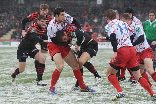 Snow joke: Edinburgh's Tim Visser gets to grips with Saracens at an icy Vicarage Road in the Heineken Cup in January 2013. Picture: Shutterstock
