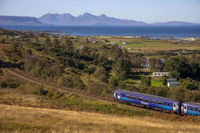 Scotrail 156 Sprinter shortly after departing Arisaig with Rum & Eigg in the distance. PIC: Contributed.
