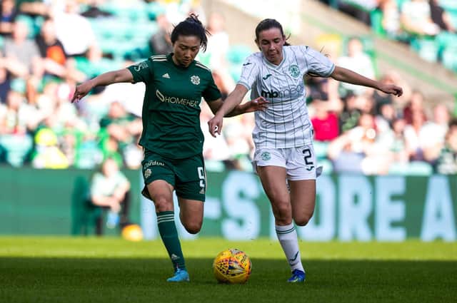 Mengyu Shen and Shannon Leishman compete for the ball in the SWPL clash at Celtic Park between Celtic and Hibs. (Photo by Craig Williamson / SNS Group)
