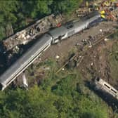 An aerial image captures the horror of the accident scene.