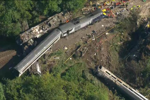 An aerial image captures the horror of the accident scene.