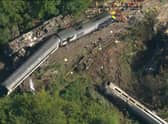 An aerial image captures the horror of the accident scene.