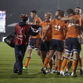 Edinburgh players celebrate at the final whistle after their Challenge Cup win over Saracens last year. (Photo by Henry Browne/Getty Images)