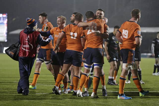 Edinburgh players celebrate at the final whistle after their Challenge Cup win over Saracens last year. (Photo by Henry Browne/Getty Images)