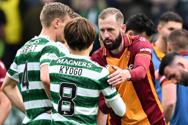Motherwell forward Kevin van Veen shakes Celtic striker Kyogo Furuhashi's hand after the 1-1 draw at Parkhead.