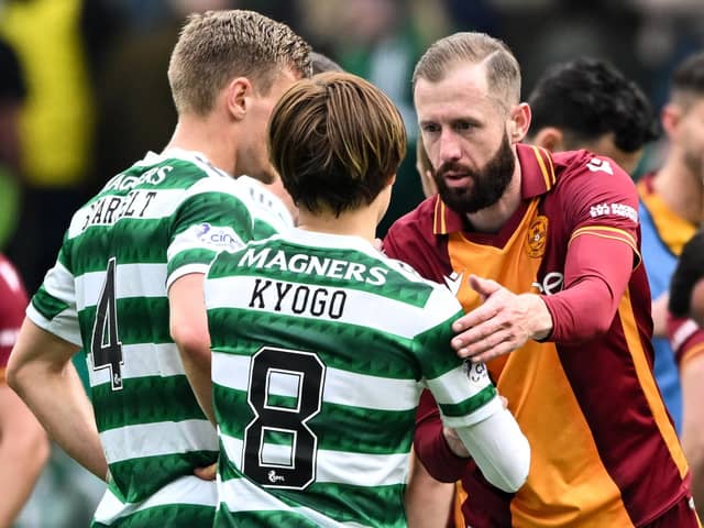 Motherwell forward Kevin van Veen shakes Celtic striker Kyogo Furuhashi's hand after the 1-1 draw at Parkhead.