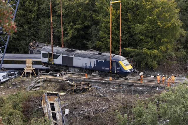 Work begins slowly clearing the derailment site.
(Picture: Derek Ironside/Newsline Media/PA Wire)