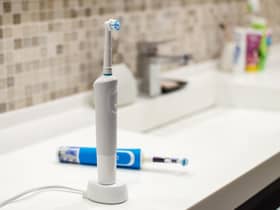 Save big on electric toothbrushes during Prime Day 2022. Photo: Canva Pro.