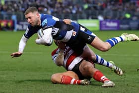 Bath's Finn Russell is tackled by George McGuigan during the Gallagher Premiership match  at The Recreation Ground. (Photo by David Rogers/Getty Images)