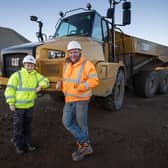 Jay Currie, 13, from Cullen, Moray, with his his father James, who has become one of the youngest trained articulated dump truck drivers after gaining his Construction Plant Competence Scheme. Picture: Paul Campbell/SPOA/PA Wire
