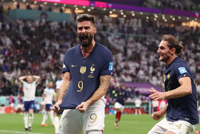 Olivier Giroud celebrates after scoring France's second goal against England. It proved the winner as France reached the semi-final of the World Cup, where they play Morocco  (Photo by Catherine Ivill/Getty Images)