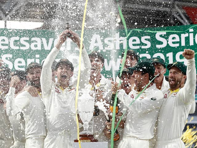 Tim Paine of Australia lifts the Urn after Australia drew the series to retain the Ashes at The Oval on September 15, 2019 (Photo by Ryan Pierse/Getty Images)
