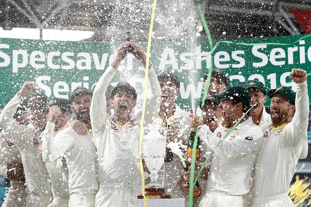 Tim Paine of Australia lifts the Urn after Australia drew the series to retain the Ashes at The Oval on September 15, 2019 (Photo by Ryan Pierse/Getty Images)