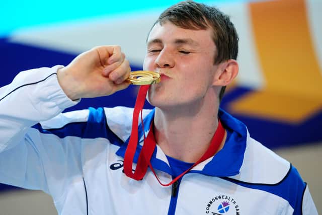 Ross Murdoch celebrates with his gold medal in Glasgow in 2014. Picture: Ian Rutherford