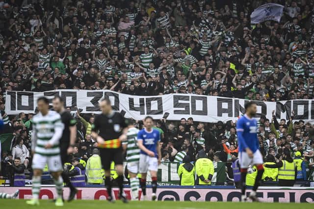 Celtic fans lord it over Rangers with a banner about trophies.