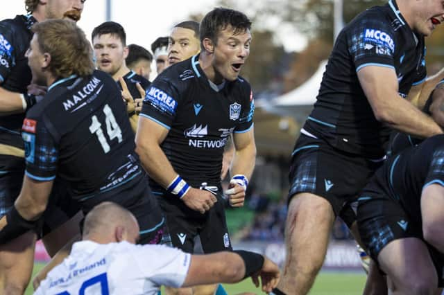 Glasgow Warriors' George Horne celebrates winning a penalty try during the URC win over Leinster.