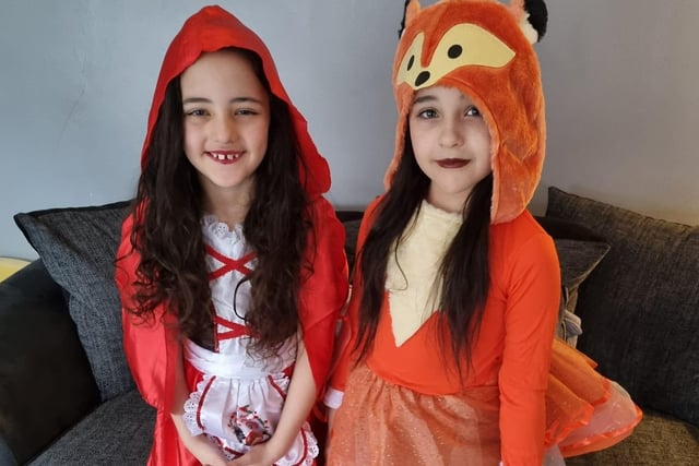 Sienna and Sophia Sweet, age 7, as Little Red Riding Hood and the wolf.