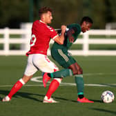 Celtic defender Osaze Urhoghide holds off a challenge from Bristol City striker Chris Martin during the pre-season friendly on Wednesday night. (Photo by Catherine Ivill/Getty Images)