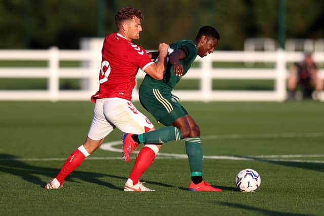 Celtic defender Osaze Urhoghide holds off a challenge from Bristol City striker Chris Martin during the pre-season friendly on Wednesday night. (Photo by Catherine Ivill/Getty Images)