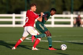 Celtic defender Osaze Urhoghide holds off a challenge from Bristol City striker Chris Martin during the pre-season friendly on Wednesday night. (Photo by Catherine Ivill/Getty Images)