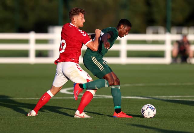 Celtic defender Osaze Urhoghide holds off a challenge from Bristol City striker Chris Martin during the pre-season friendly on Wednesday night. (Photo by Catherine Ivill/Getty Images)