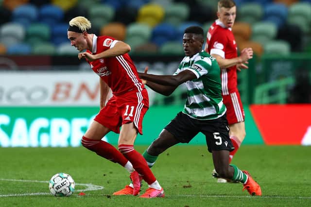 Ryan Hedges of Aberdeen is challenged by Sporting Lisbon's Nuno Mendes (Photo by Carlos Rodrigues/Getty Images)