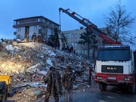 Rescue workers and volunteers search for survivors in the rubble of a collasped building, in Sanliurfa, Turkey, on February 6, 2023, after a 7.8-magnitude earthquake struck the country's south-east. - The combined death toll has risen to over 2,300 for Turkey and Syria after the region's strongest quake in nearly a century. Turkey's emergency services said at least 1,121 people died in the earthquake, with another 783 confirmed fatalities in Syria. (Photo by REMI BANET / AFP) (Photo by REMI BANET/AFP via Getty Images)