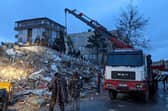 Rescue workers and volunteers search for survivors in the rubble of a collasped building, in Sanliurfa, Turkey, on February 6, 2023, after a 7.8-magnitude earthquake struck the country's south-east. - The combined death toll has risen to over 2,300 for Turkey and Syria after the region's strongest quake in nearly a century. Turkey's emergency services said at least 1,121 people died in the earthquake, with another 783 confirmed fatalities in Syria. (Photo by REMI BANET / AFP) (Photo by REMI BANET/AFP via Getty Images)
