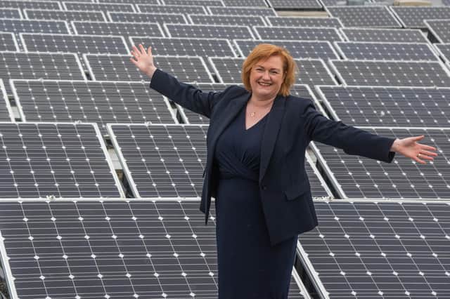 Principal Angela Cox is pictured surrounded by solar panels on the roof of Borders college, ahead of launching the institution's ambitious new sustainability strategy
