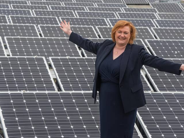 Principal Angela Cox is pictured surrounded by solar panels on the roof of Borders college, ahead of launching the institution's ambitious new sustainability strategy