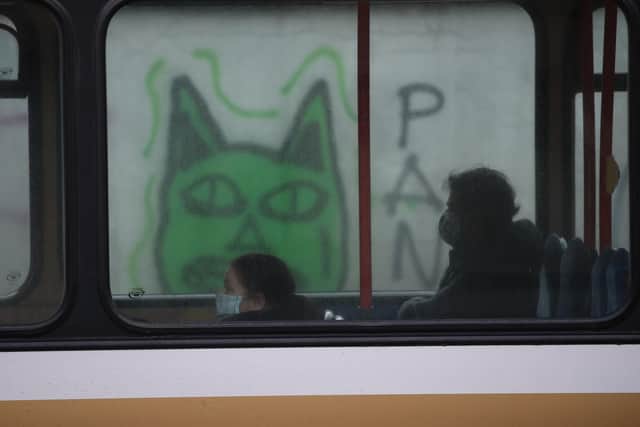 Two people sit on a bus in Edinburgh. Talks are being held with the UK Government about additional border controls. Picture: Andrew Milligan/PA Wire