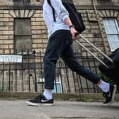 Members of the public walk past a Black Lives Matter street sign in Edinburgh in June 2020. Activists hung alternative street signs on several streets and buildings with ties to Scotland’s slave trade around the city