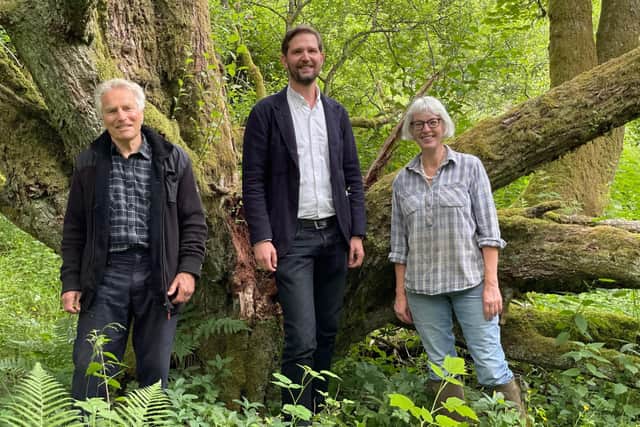 Blackwood Estate Community Association treasurer and trustee Vicki Connick and trustee Terry Wise with Robin Winstanley, sustainability and external affairs manager for Kype Muir wind farm owner Banks Renewables