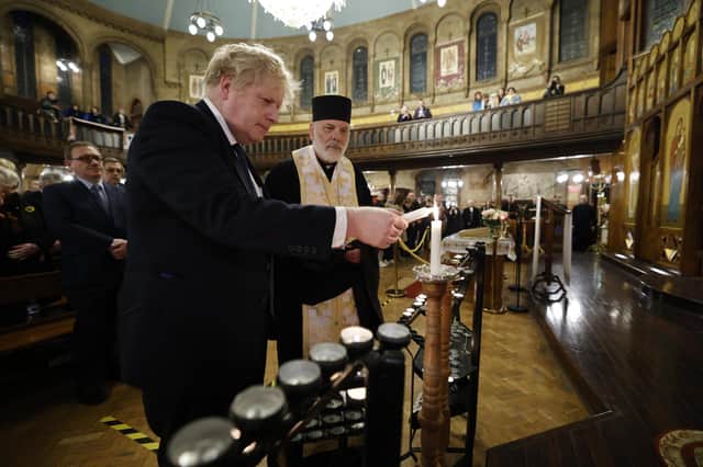 Boris Johnson joins people during services at the Ukrainian Catholic Cathedral in Mayfair, London, on Sunday (Picture: Jamie Lorriman/WPA Pool/Getty Images)