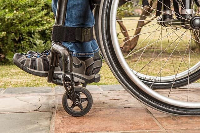 The 20-metre-rule has cost people with disabilities financial support and mobility vehicles, the MS Society Scotland says