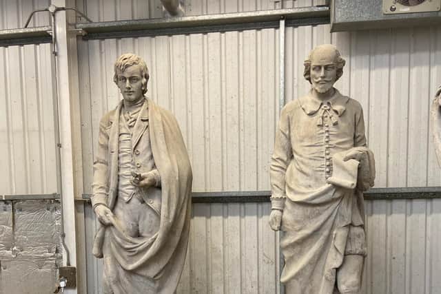 The restored statues of Robert Burns and William Shakespeare.