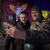 Ukrainian president Volodymyr Zelensky posing for a selfie picture with a Ukrainian soldier as he visits the Donetsk region, amid the Russian invasion of Ukraine. Picture: Stringer/Ukrainian Presidential Press Ser/AFP via Getty Images