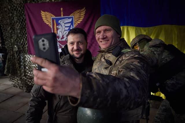 Ukrainian president Volodymyr Zelensky posing for a selfie picture with a Ukrainian soldier as he visits the Donetsk region, amid the Russian invasion of Ukraine. Picture: Stringer/Ukrainian Presidential Press Ser/AFP via Getty Images