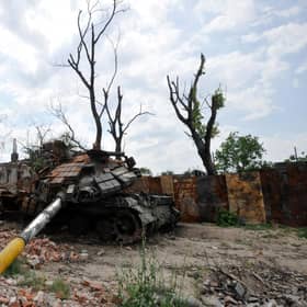 A destroyed tank is pictured in the village of Novoselivka, outside Chernigiv, on June 21, 2022, amid the Russian invasion of Ukraine. (Photo by Sergei CHUZAVKOV / AFP) (Photo by SERGEI CHUZAVKOV/AFP via Getty Images)