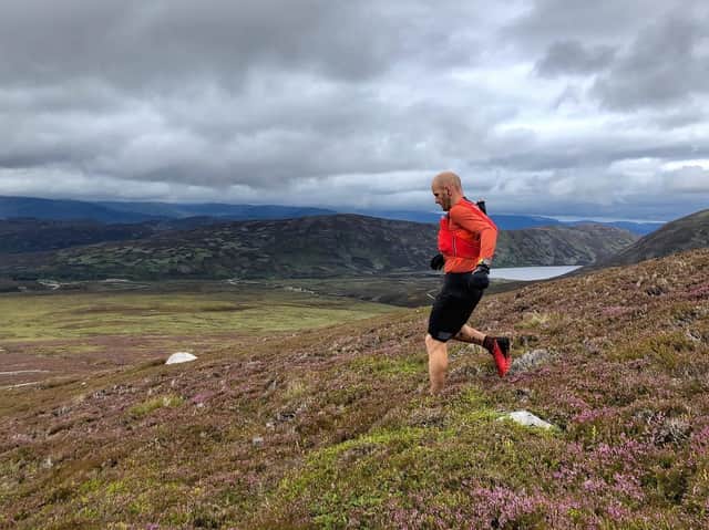 Donnie Campbell descends the heathery slope of a Drumochter hill during his record attempt (Donnie Campbell)