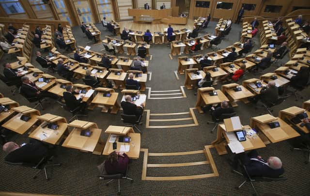 MSPs social distancing with every second seat removed at the Scottish Parliament at Holyrood. Emma Walker had been seeking to run for the Scottish Liberal Democrats at next year's Holyrood elections
