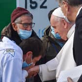 Pope Francis meets refugees at a reception centre on the island of Lesbos during a visit to Greece, when he called for better treatment of migrants by European countries (Picture: Andreas Solaro/AFP via Getty Images)