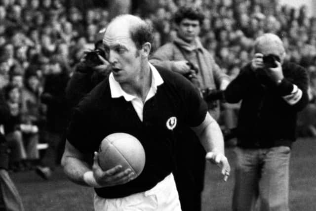 Scotland captain Mike Biggar takes to the field.