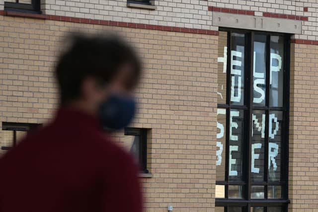 Students at Glasgow University's Murano Street Village in Glasgow make a point during the lockdown in September (Picture: Andrew Milligan/PA)