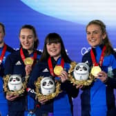 Great Britain's Eve Muirhead, Vicky Wright, Jennifer Dodds, Hailey Duff and Mili Smith celebrate with their gold medals after the Women's Gold Medal Game against Japan  (Photo: Andrew Milligan/PA Wire.)