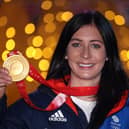 Team GB skip Eve Muirhead poses with her gold medal from the Beijing Winter Olympics. (Photo by Warren Little/Getty Images)