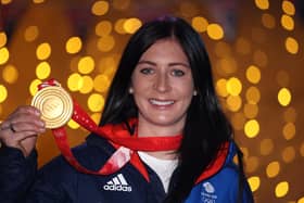 Team GB skip Eve Muirhead poses with her gold medal from the Beijing Winter Olympics. (Photo by Warren Little/Getty Images)